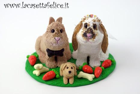 cake topper con due coniglietti e un cagnolino
